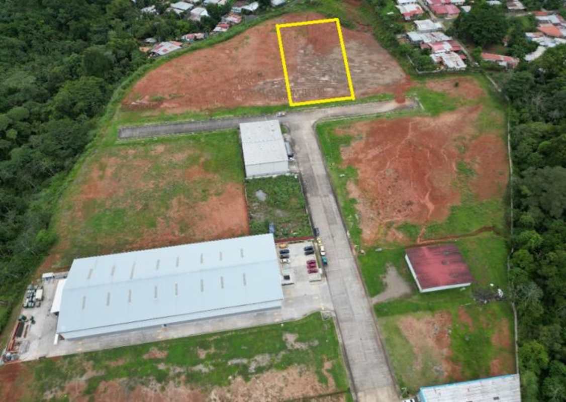 Development lot with adjacent warehouses aerial view Panama City