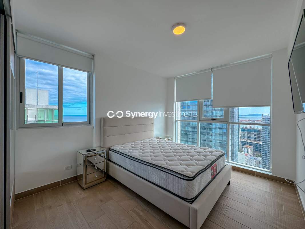 Modern kitchen with granite countertops island stove stainless appliances PH Dynasty Residences Bella Vista Panama City