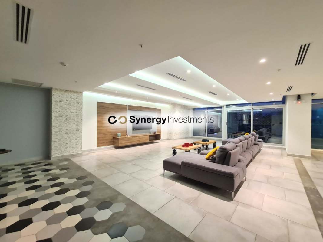 Modern open living lounge bright windows furnishing skyline PH Dynasty Residences Panama