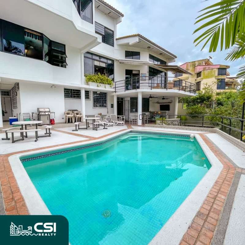 Swimming pool, BBQ, sun loungers in luxury Panama family home outdoor area Dos Mares