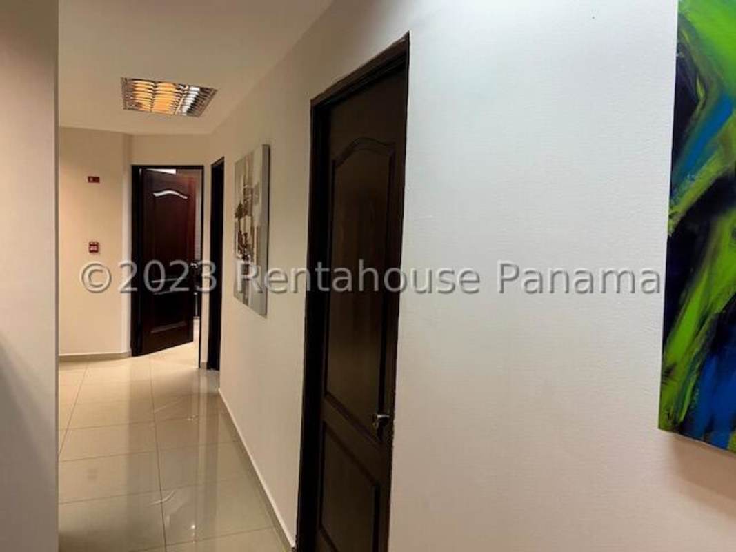 Interior hallway with ceramic floors, paintings, recessed lighting in PH Bella Vista Tower Panama City