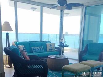 Master bedroom with balcony access and Pacific Ocean view at PH Bahía Panama