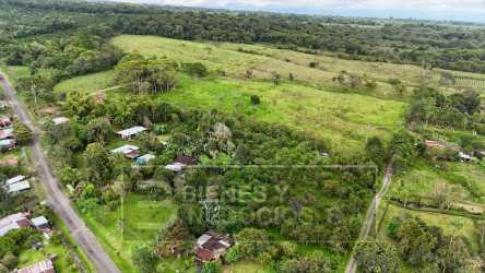 Scattered rural houses, green fields, forest patches on a large farm property in Boquerón Chiriquí Panama
