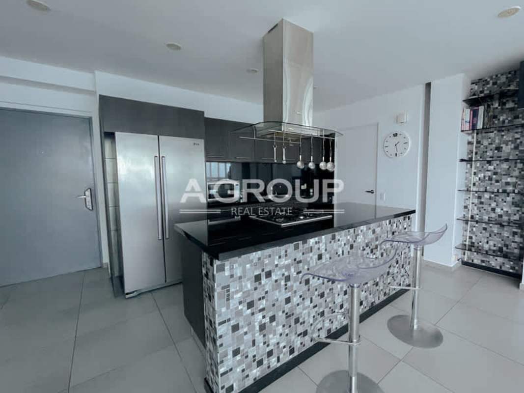 Contemporary kitchen with granite countertops, integrated lighting in PH Yacht Club Panama City