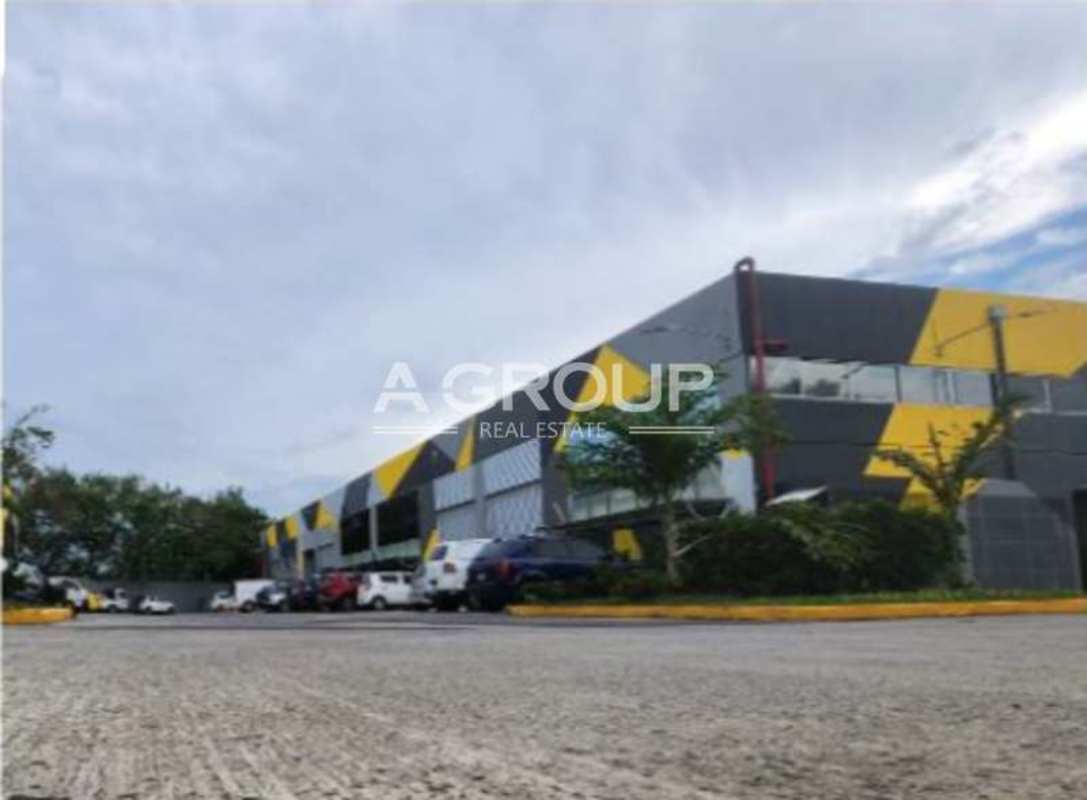 Contemporary industrial warehouse with large parking area and modern facade near Costa del Este Panama