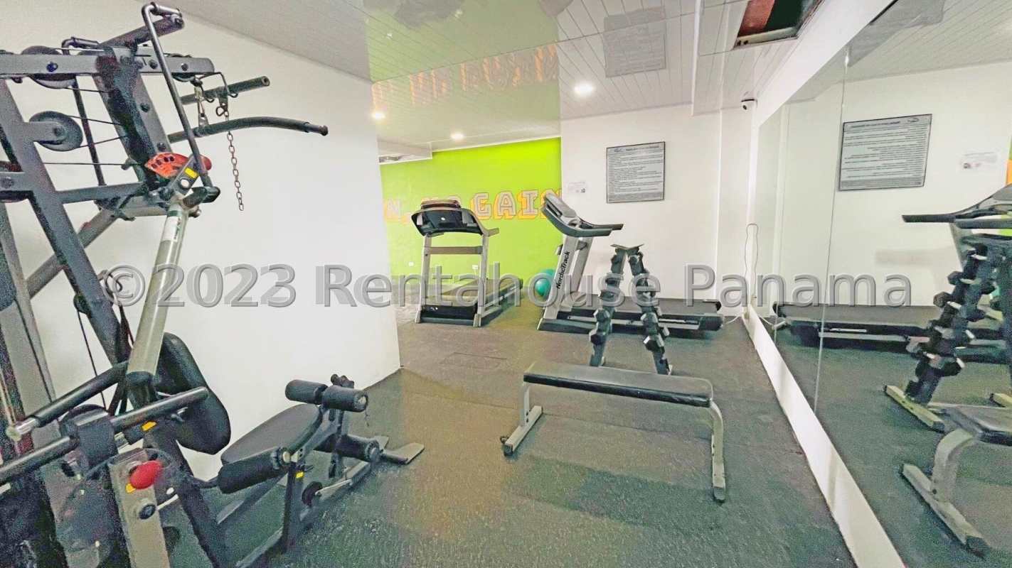 Modern gym with fitness equipment and sports court rooftop views Constellation Tower Panama