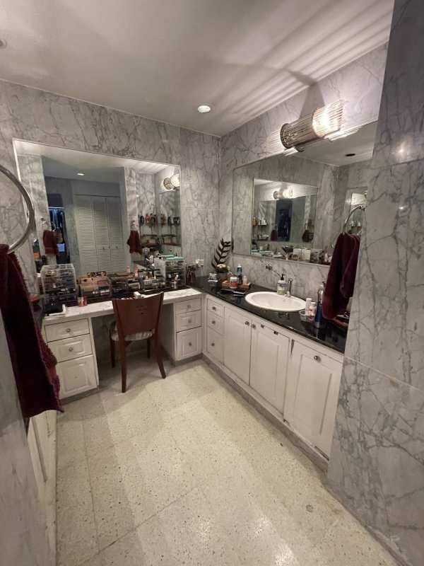Luxury marble bathroom dual sink vanity and large mirrors in Dos Mares home Panama City