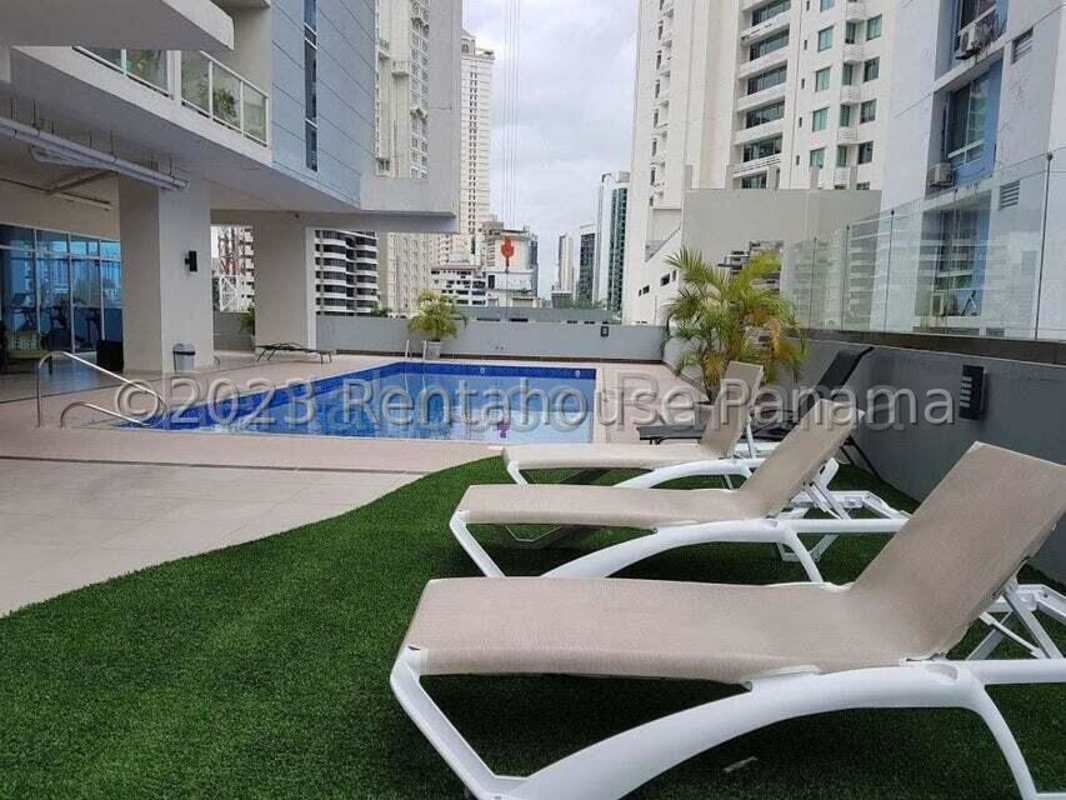 Covered outdoor terrace with BBQ grills and dining area in PH Miramar Avenida Balboa Panama