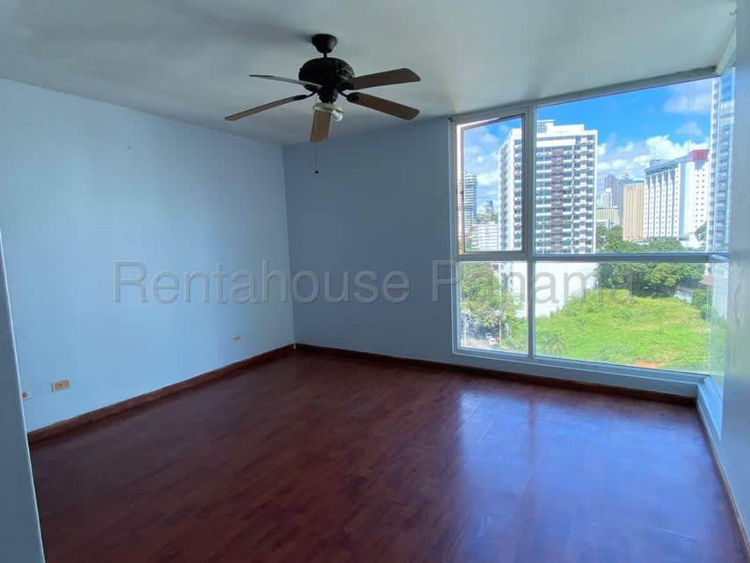 Spacious bedroom with large window city skyline view in PH Miramar Tower Bella Vista Panama