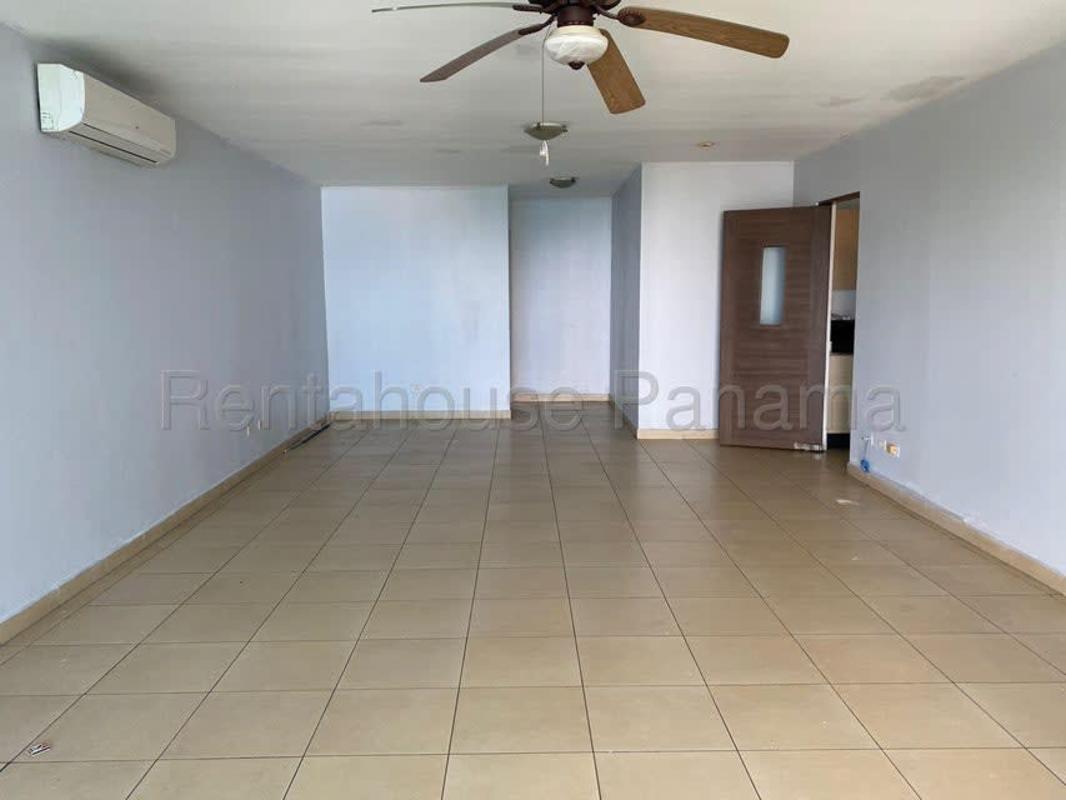 Infinity rooftop pool with lounge chairs and stunning city ocean views in PH Miramar Avenida Balboa Panama City