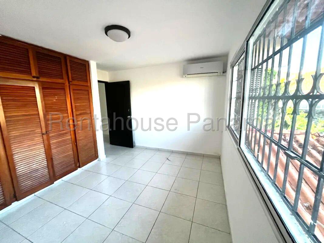 Master bedroom with walk-in closet and large window Altos de Santa María Panama City