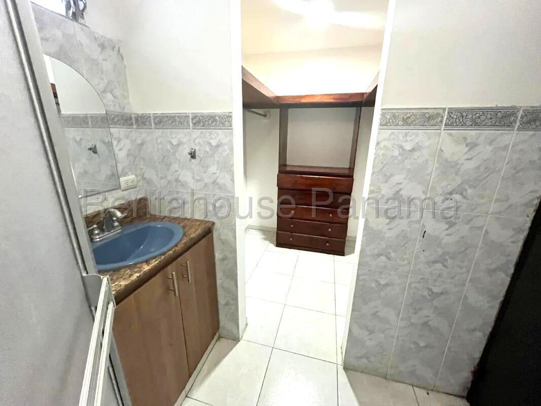 Second bedroom with built-in closet and window in Altos de Santa María Panama