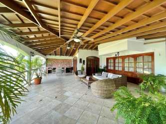 Bedroom with large windows, AC, ceiling fan, modern decor in beach villa Playa Blanca Panama