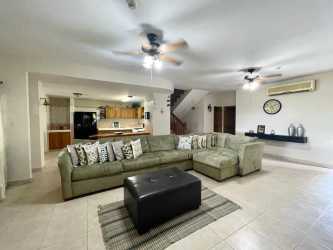 Bathroom with double sinks, granite countertop, large mirror, ceramic tile beach villa Playa Blanca