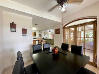 Covered patio terrace with BBQ area wicker furniture and garden views Playa Blanca