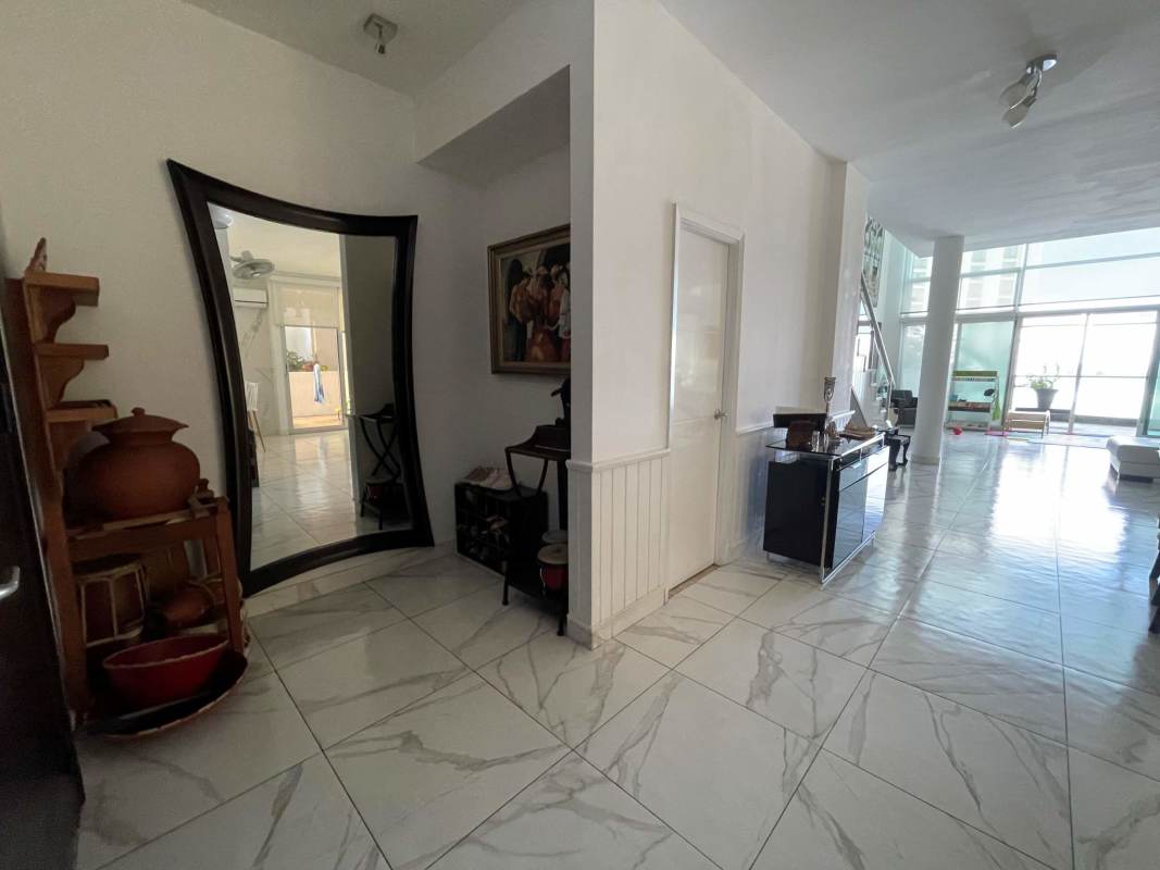 Elegant bedroom with marble floor, large window views at PH Premier Loft Panama