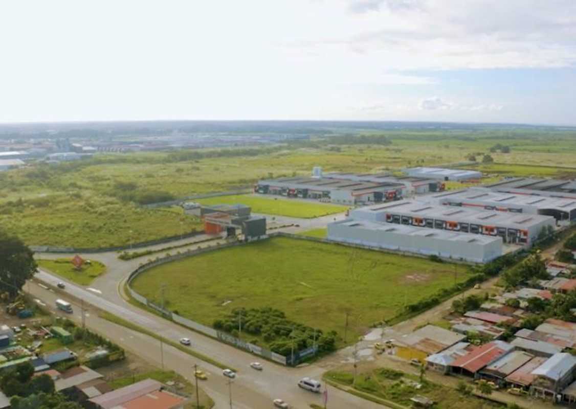 Aerial view of Panama industrial park with warehouses, free zone facilities, and accessible road networks near Tocumen