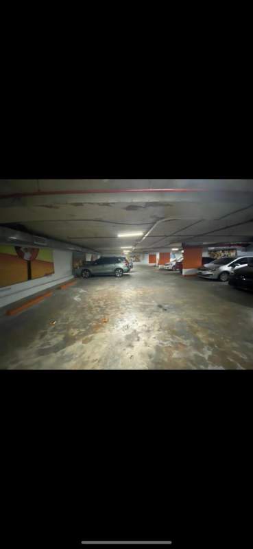 Multiple cars parked inside underground garage PH Le Blue commercial Panama City