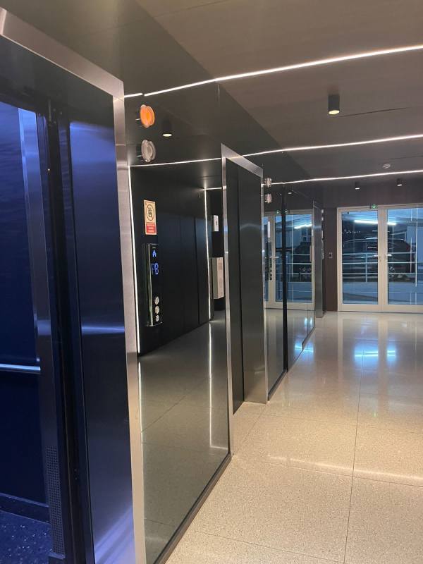 Spacious living room with wall-mounted TV and shelving PH Bonavista Panama City