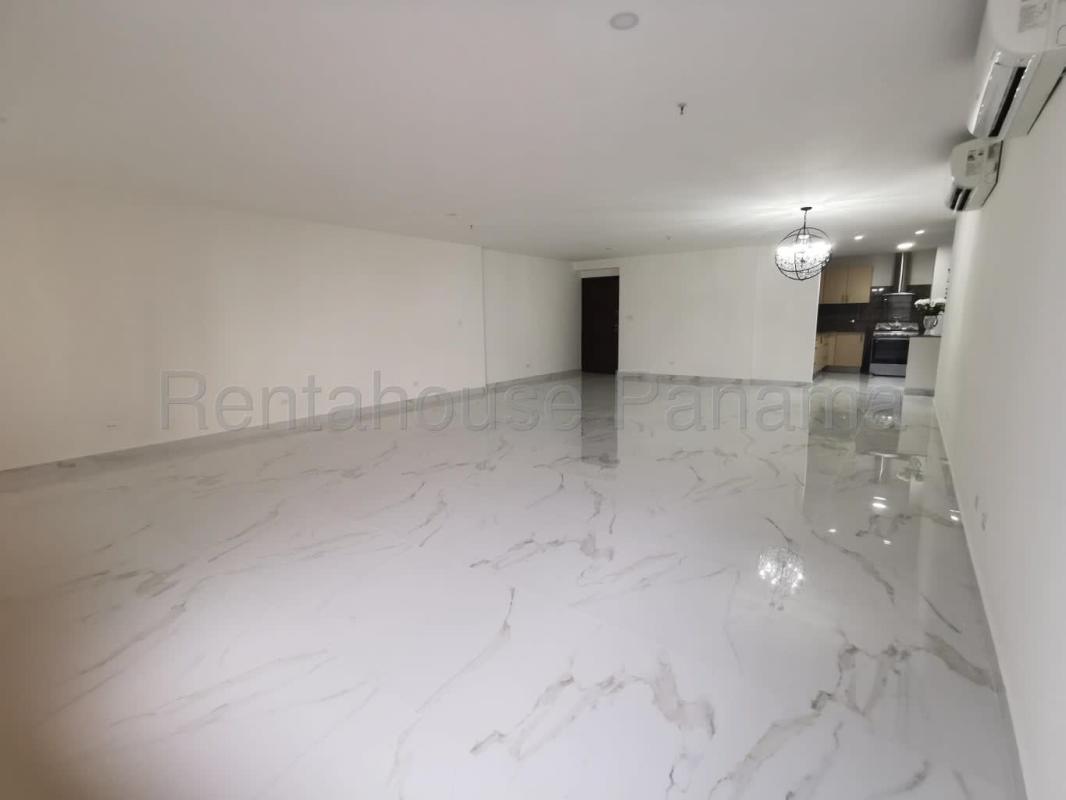 Kitchen with granite countertops, wood cabinets, stainless appliances in PH Parque del Mar II Costa del Este Panama