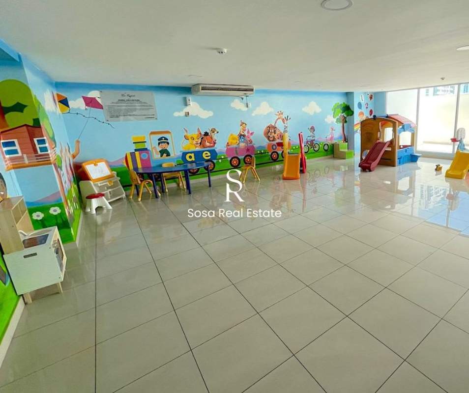 Colorful indoor children's playroom with toys and slides in PH near Parque Omar Panama