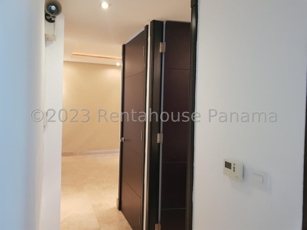 Master bedroom with large windows ocean view modern design in PH Coco del Mar Panama City