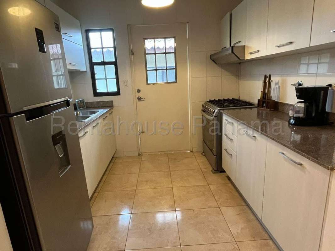 Large bright living dining space with ceramic floors in house for sale PH Vistas del Lago Las Cumbres Panama City