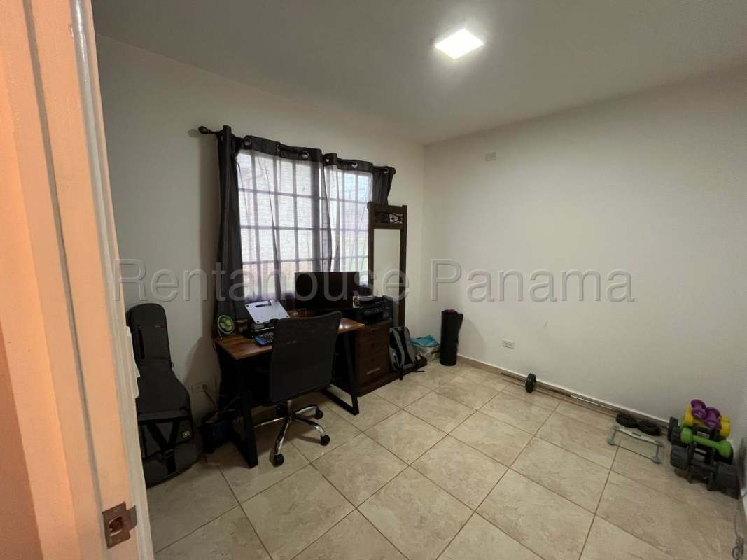 Second bedroom with closet, tile flooring in PH Vistas del Lago Las Cumbres Panama City