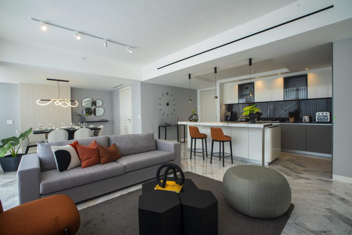 Open kitchen with marble countertops, island and luxury appliances PH Wanders & Yoo Marbella Panama