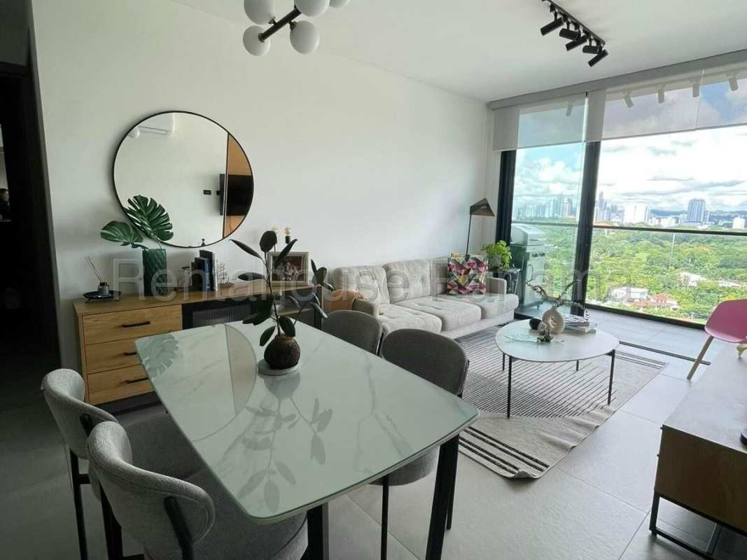 Combined living and dining space with city views in furnished apartment PH Victory Tower Coca del Mar Panama