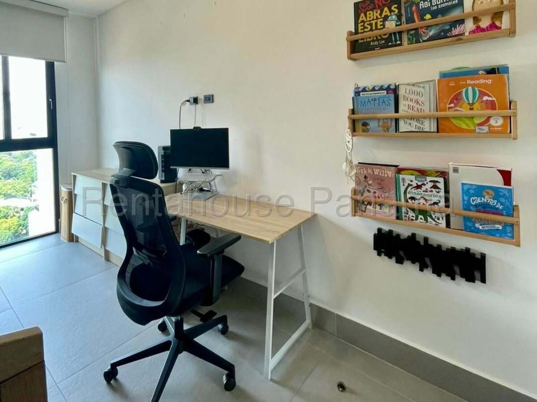 Bright home office area with large windows and plenty of natural light in Victory Tower Panama