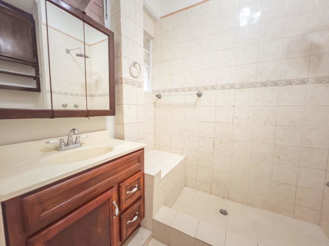 Functional kitchen with tile backsplash, appliances, and window Clayton Panama