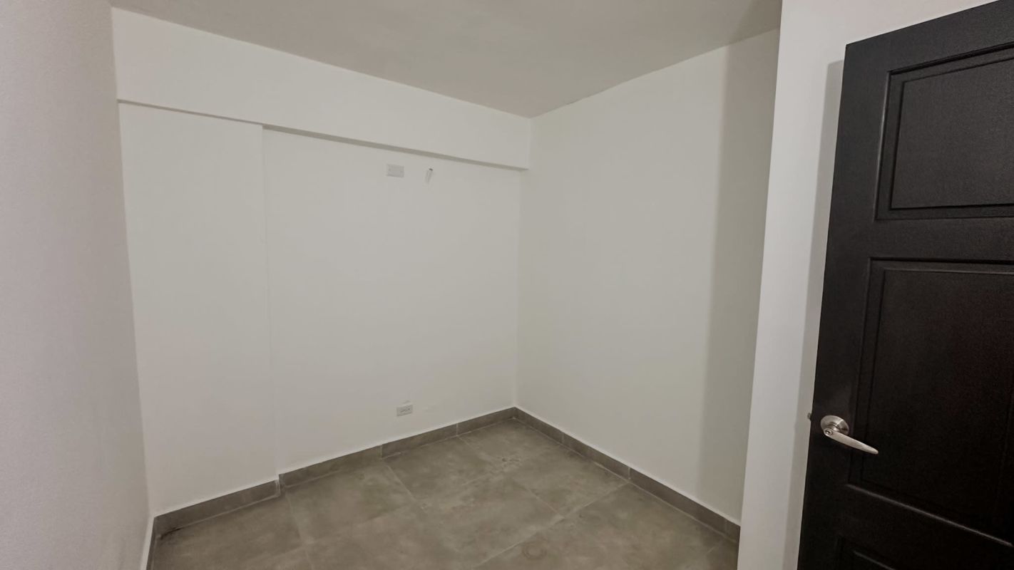Minimalist white hall corridor with tile floors in PH Moliterno Rio Abajo Panama City