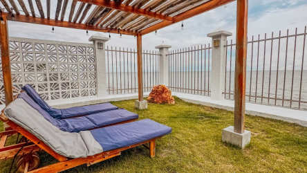 Rustic bedroom wood beam ceiling, AC and large window in Playa Malibu Panama