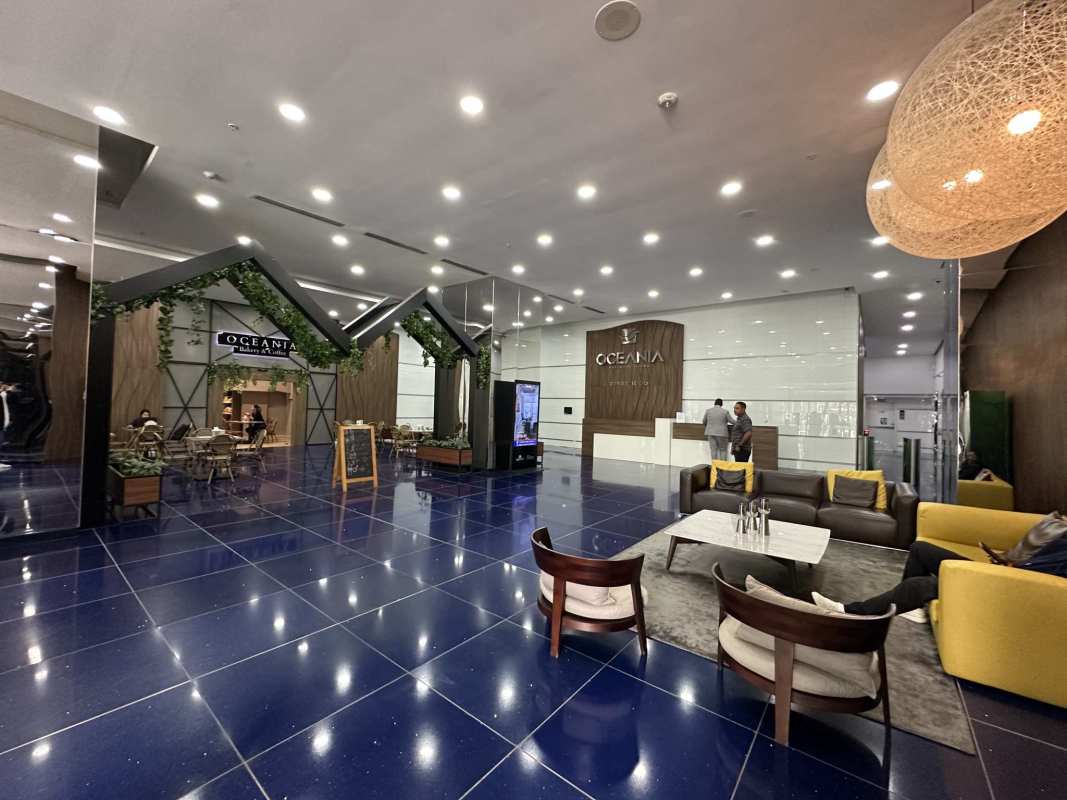 Elegant lobby with reception and cafe area Oceania Business Plaza