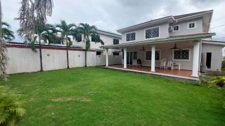 Open plan living and dining area finished in marble tile with ample windows in Margarita Colón