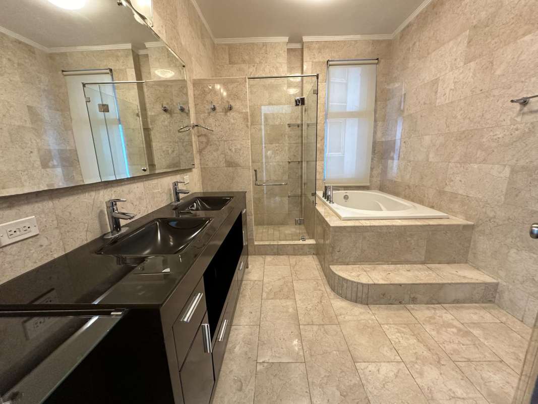 Bright modern kitchen with granite counters, large windows, laundry area PH Pacific Village Punta Pacífica