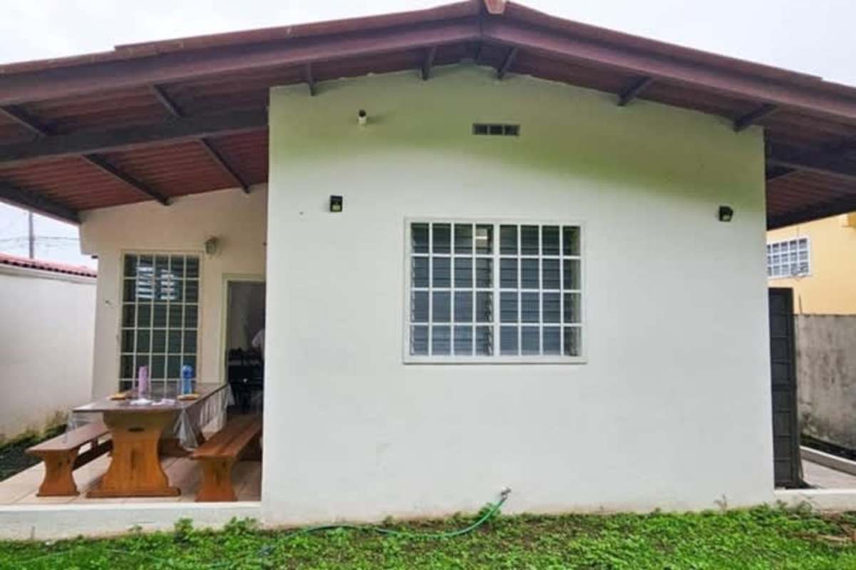 Exterior of single-story house with garden and covered porch for rent in Brisas del Occidente Panama