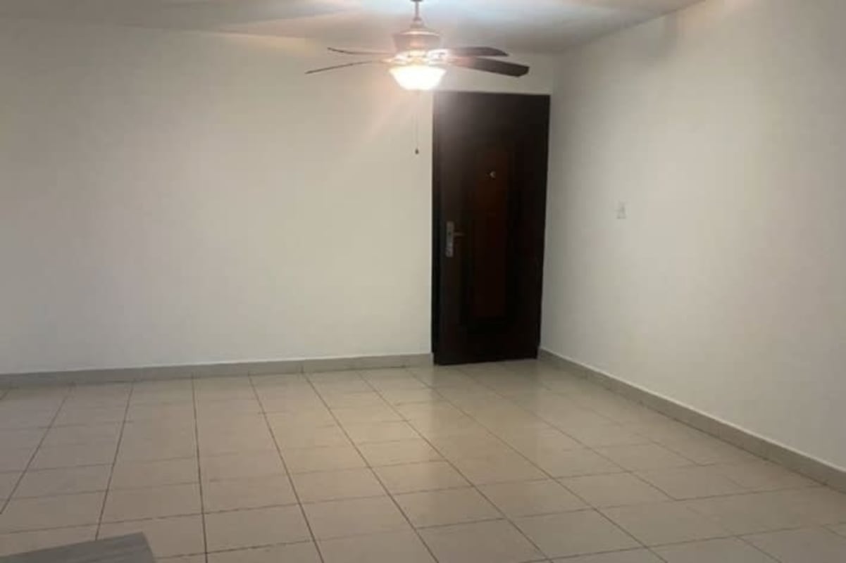 Modern kitchen with cabinets, refrigerator, gas stove and washer hookup at PH Hato Pintado Panama apartment