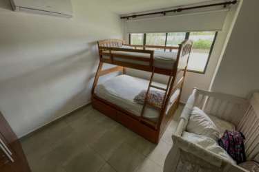 Kitchen featuring granite counters oven large window Punta Paraíso beach house