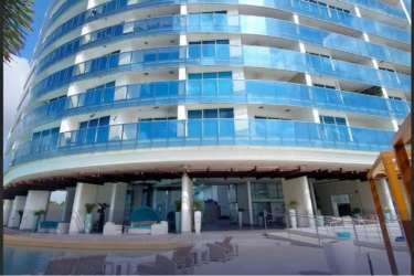 Luxury beachfront tower with curved balconies Ocean Waves Panama