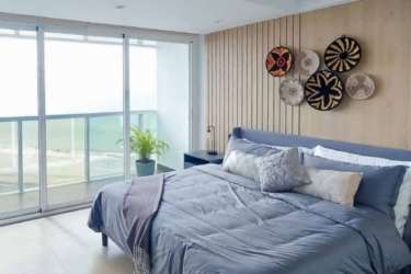 Open plan living dining area with large windows Ocean Waves Panama