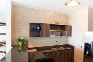 Beachfront terrace lounge area with wooden pergolas Ocean Waves Panama