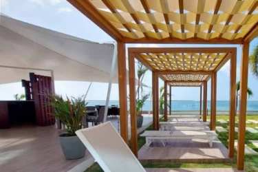 Coastal lounge with white sofas and aqua accents PH Ocean Waves Panama