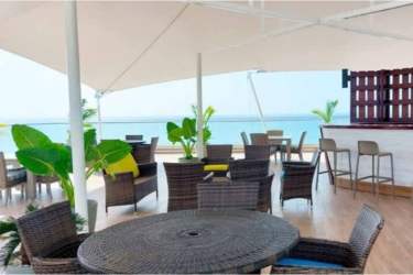 Outdoor terrace lounge with ocean view canopy bar Ocean Waves Gorgona