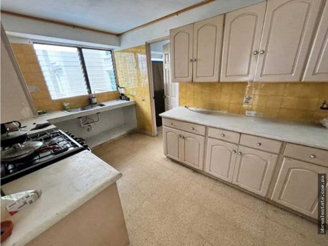 Kitchen with yellow backsplash, large windows, dual sink PH Vista del Este Panama City