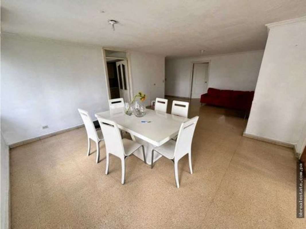 Open plan dining room with neutral tiles and bright windows PH Vista del Este Bella Vista Panama