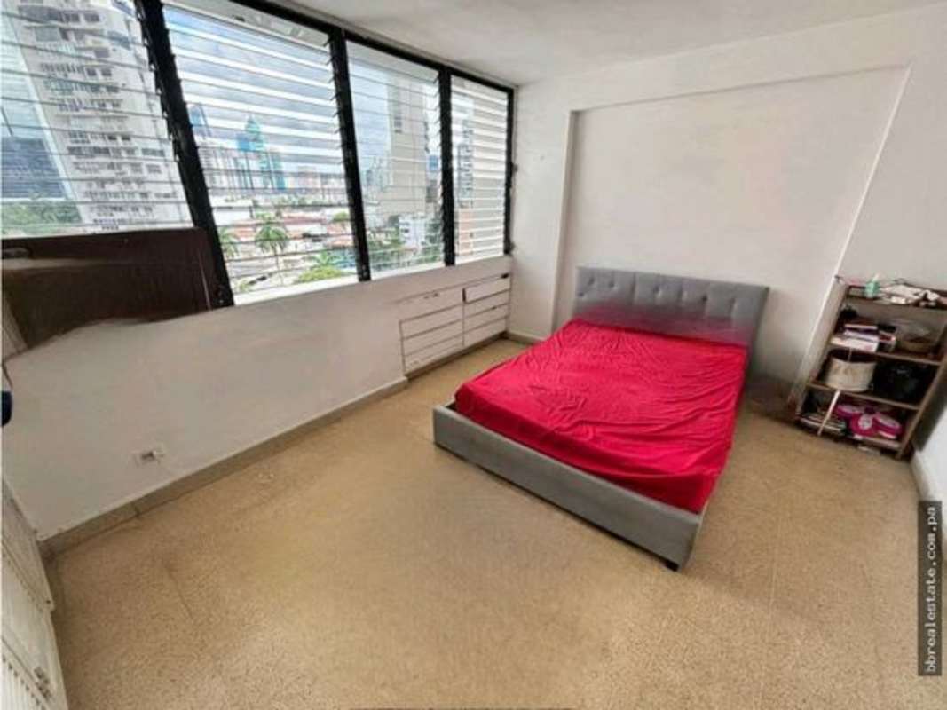 Bedroom featuring large city-facing windows with closet PH Vista del Este Panama