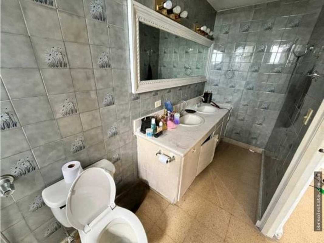 Bathroom with dual sink vanity, large mirror, and ceramic tiles PH Vista del Este Panama City