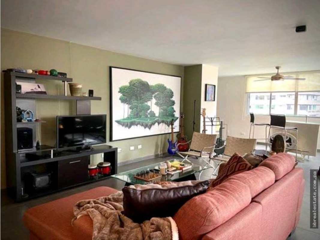 Open living room area with floor-to-ceiling windows and natural light in PH La Joya Punta Paitilla Panama